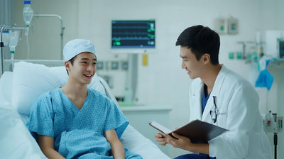 Doctor talking to a cancer patient in a hospital bed