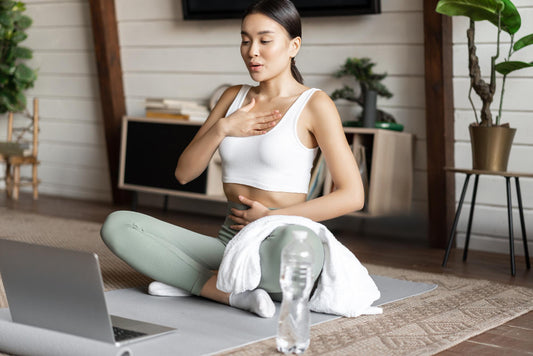 Woman exercising on a mat