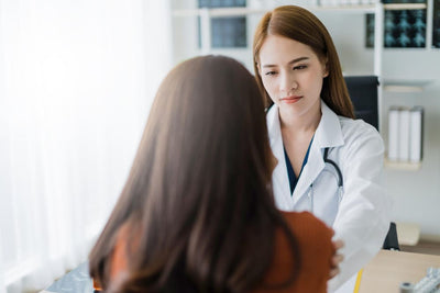 Doctor listening and evaluating a patient in an clinic setting