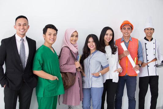 Group of people in various attire standing together  and different profession against a white background