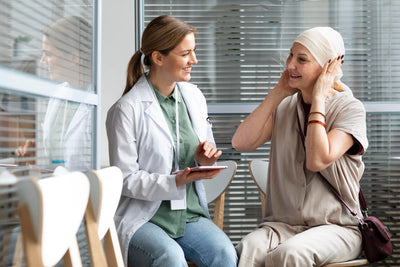 Doctor and patient in a consultation room regarding patient condition.