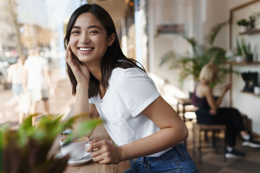 Woman smiling at the cafe. Routine lifestyle