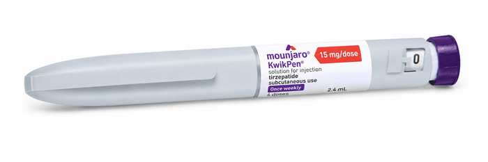 A Mounjaro KwikPen 15 mg/dose injection pen, featuring a white plastic body with purple and red accents, set against a plain white background.