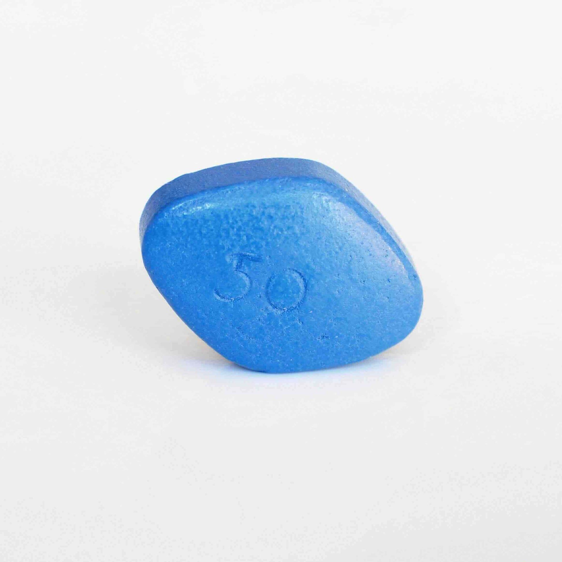 A single blue sildenafil tablet, typically used for treating erectile dysfunction, with the number 50 imprinted on it.