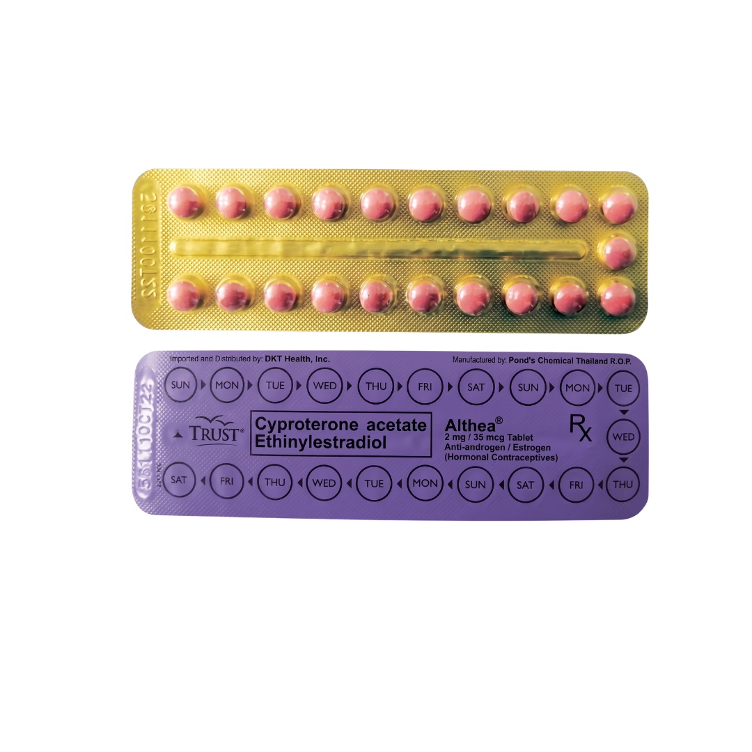 Contraceptive pills in a yellow and purple packaging on a white background