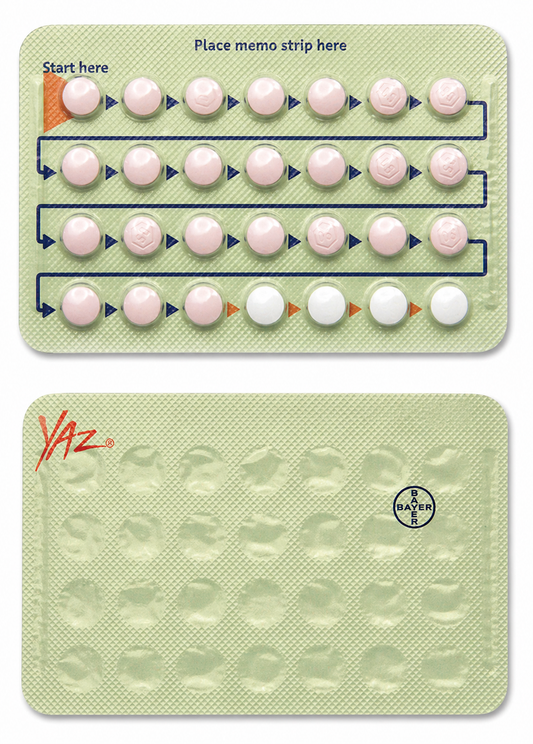 Yaz birth control pill packaging with pills arranged in a grid on a light green background.