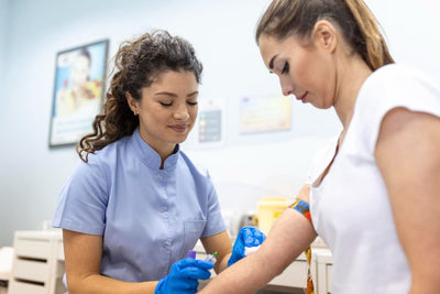 Health Care Person drawing blood from the patient